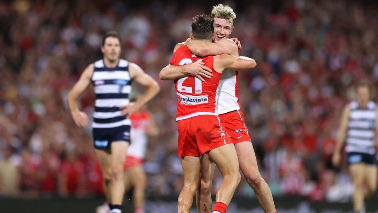 SYDNEY, AUSTRALIA - MARCH 25: ChadÂ Warner of the Swans celebrates a goal with ErrolÂ Gulden of the Swans during the round two AFL match between the Sydney Swans and the Geelong Cats at Sydney Cricket Ground on March 25, 2022 in Sydney, Australia. (Photo by Cameron Spencer/Getty Images)