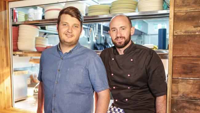 Miranda Kerr's brother Matt Kerr (left) with his husband Jimmy at their restaurant, Nanna Kerr's Kitchen. Picture: Hareth Tayem