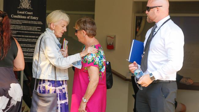 Malyschko’s mother Bronwyn Buttery (centre) and Detective David Munro leaving the Darwin Magistrates Court. Picture: Glenn Campbell