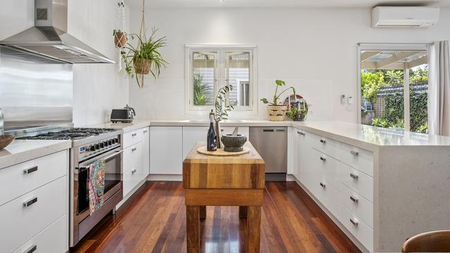 A servery window is a handy addition to the kitchen.