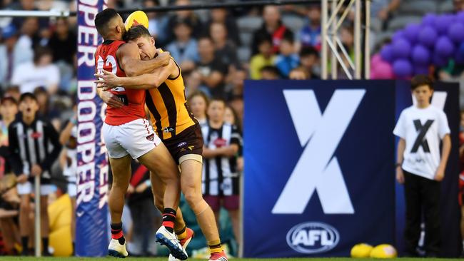 Adam Saad of the Bombers is tackled by Dallas Willsmore of the Hawks.