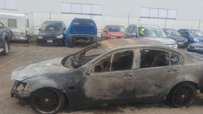 The burnt out Holden Commodore suspected to be used as an escape vehicle.