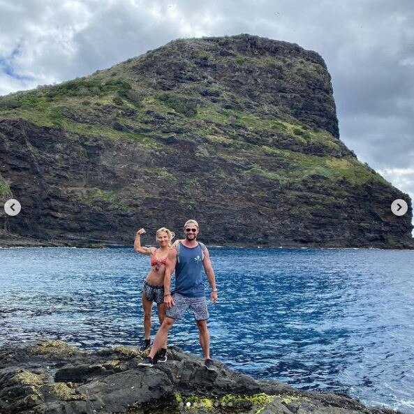 The Hemsworths show off more of the island and their muscles.