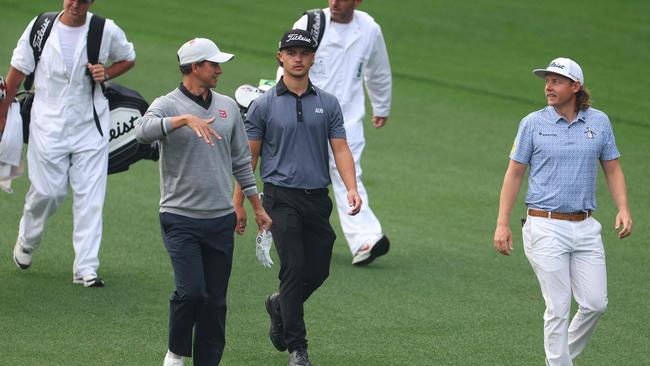 Harrison Crowe with Cameron Smith and Adam Scott at the 2023 Masters. (Photo by Andrew Redington / GETTY IMAGES NORTH AMERICA / Getty Images via AFP)