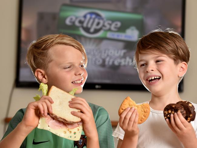 Jet, 11, and Darcy, 7, get hungry with all the food ads on TV. Picture: Jay Town