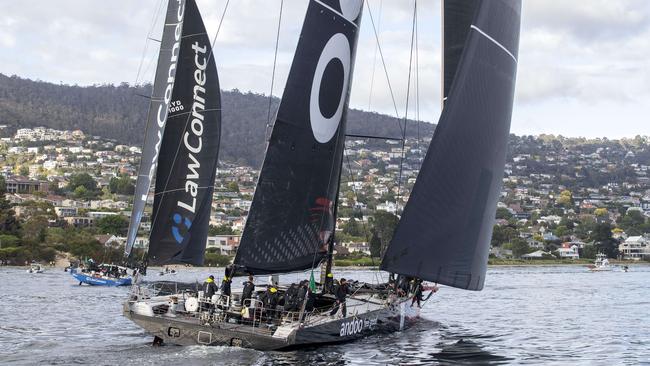 Eventual race winner LawConnect passes 2nd place Andoo Comanche in the Derwent River during the 2023 Rolex Sydney Hobart yacht race. Picture: Chris Kidd