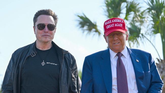 BROWNSVILLE, TEXAS - NOVEMBER 19: U.S. President-elect Donald Trump greets Elon Musk as he arrives to attend a viewing of the launch of the sixth test flight of the SpaceX Starship rocket on November 19, 2024 in Brownsville, Texas. SpaceXâs billionaire owner, Elon Musk, a Trump confidante, has been tapped to lead the new Department of Government Efficiency alongside former presidential candidate Vivek Ramaswamy.   Brandon Bell/Getty Images/AFP (Photo by Brandon Bell / GETTY IMAGES NORTH AMERICA / Getty Images via AFP)