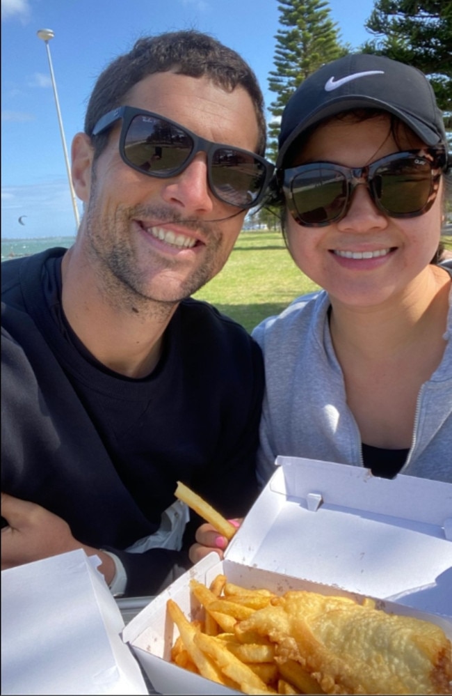 Simon Nellist and Jessie Ho, eating fish and chips at the beach.