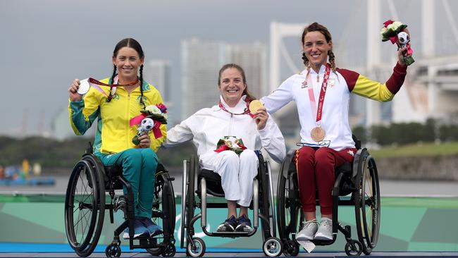 Lauren Parker shows off her silver medal after her brave performance oin the triathlon.