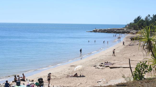 Beachgoers brave the water after a 2m croc spotted at Nightcliff Beach. Picture: (A)manda Parkinson