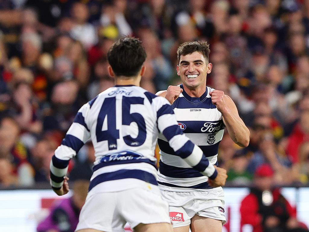 Shaun Mannagh celebrates a goal with Brad Close during the clash between the Crows and the Cats at Adelaide Oval. Picture: Sarah Reed/AFL Photos via Getty Images.