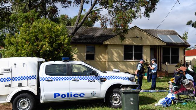 Police outside the house where the man died. Picture: James Gourley