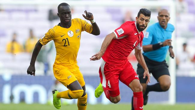 Awer Mabil of Australia competes for the ball with Baha' Abdel-Rahman of Jordan. Picture: Getty