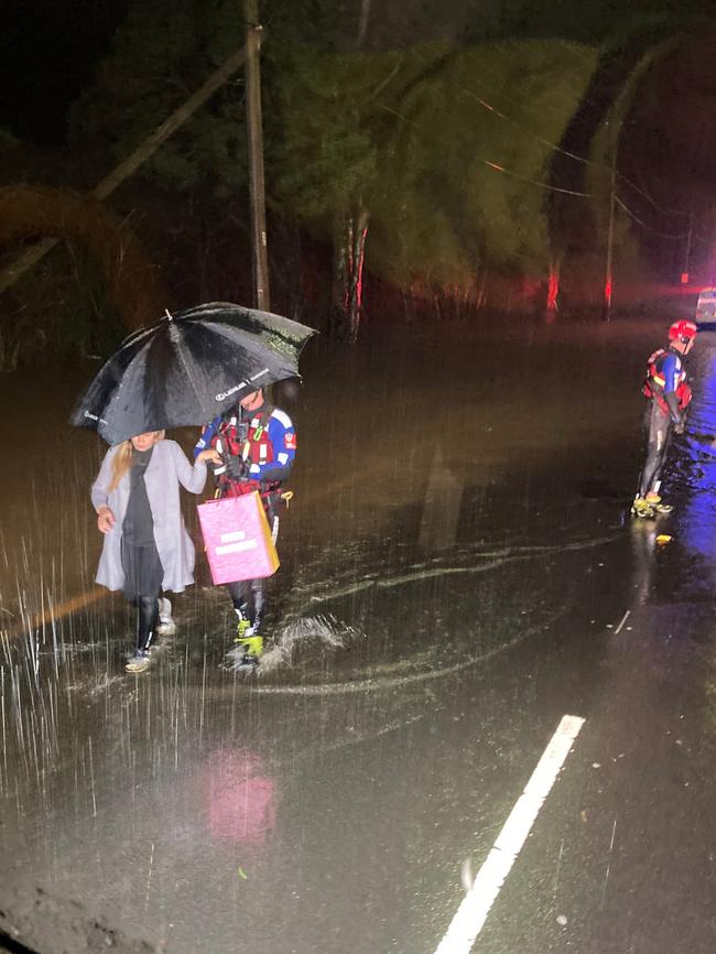 A Fire and Rescue NSW (FRNSW) crew has saved a family of five, including a pregnant mother, from a car in floodwaters tonight at Revesby Heights.