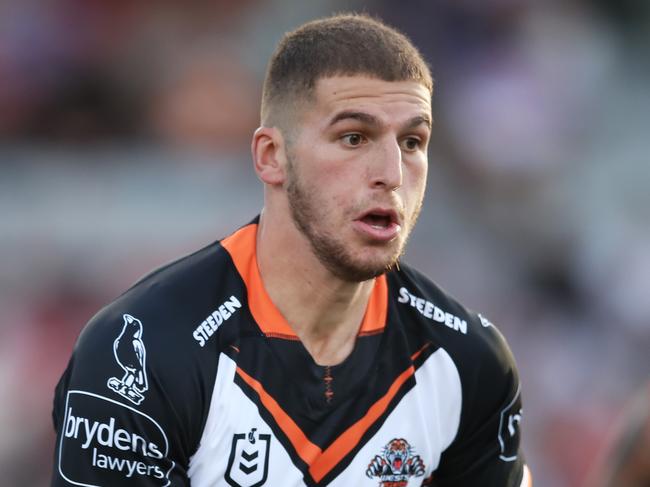 WOLLONGONG, AUSTRALIA - MAY 02:  Adam Doueihi of the Tigers runs with the ball during the round eight NRL match between the St George Illawarra Dragons and the Wests Tigers at WIN Stadium, on May 02, 2021, in Wollongong, Australia. (Photo by Matt King/Getty Images)