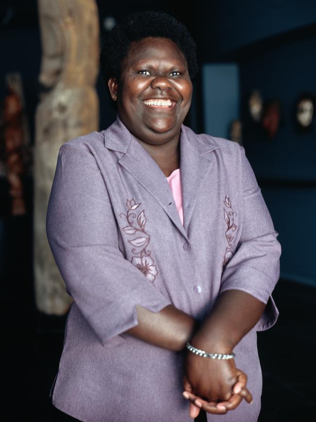 Of Balai (pictured here in 2008), Bridgeman said: “She is a guide, supporter and mother figure to many diaspora artists. Aunty Sana came to my studio for a sitting. The walls are painted pink and green, and decorated with bilums, handwoven bags that represent motherhood. I painted her in the black-and-white dress she was wearing. I added a kakapa (grass skirt) and traditional bilas (body adornment) in the form of white dots (a bun turu tubur) that symbolise ancestors and a pathway. I inserted myself in the portrait wearing my work boots and holding a kuman, a shield from my region in PNG. Aunty Sana sat with her hands curled on her lap. It looked like a love heart, so I added this as a sign of her giving nature.”