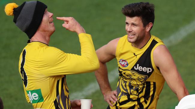 Trent Cotchin cuts a relaxed figure at training with teammate and fellow Tigers leader Jack Riewoldt. Picture: Alex Coppel