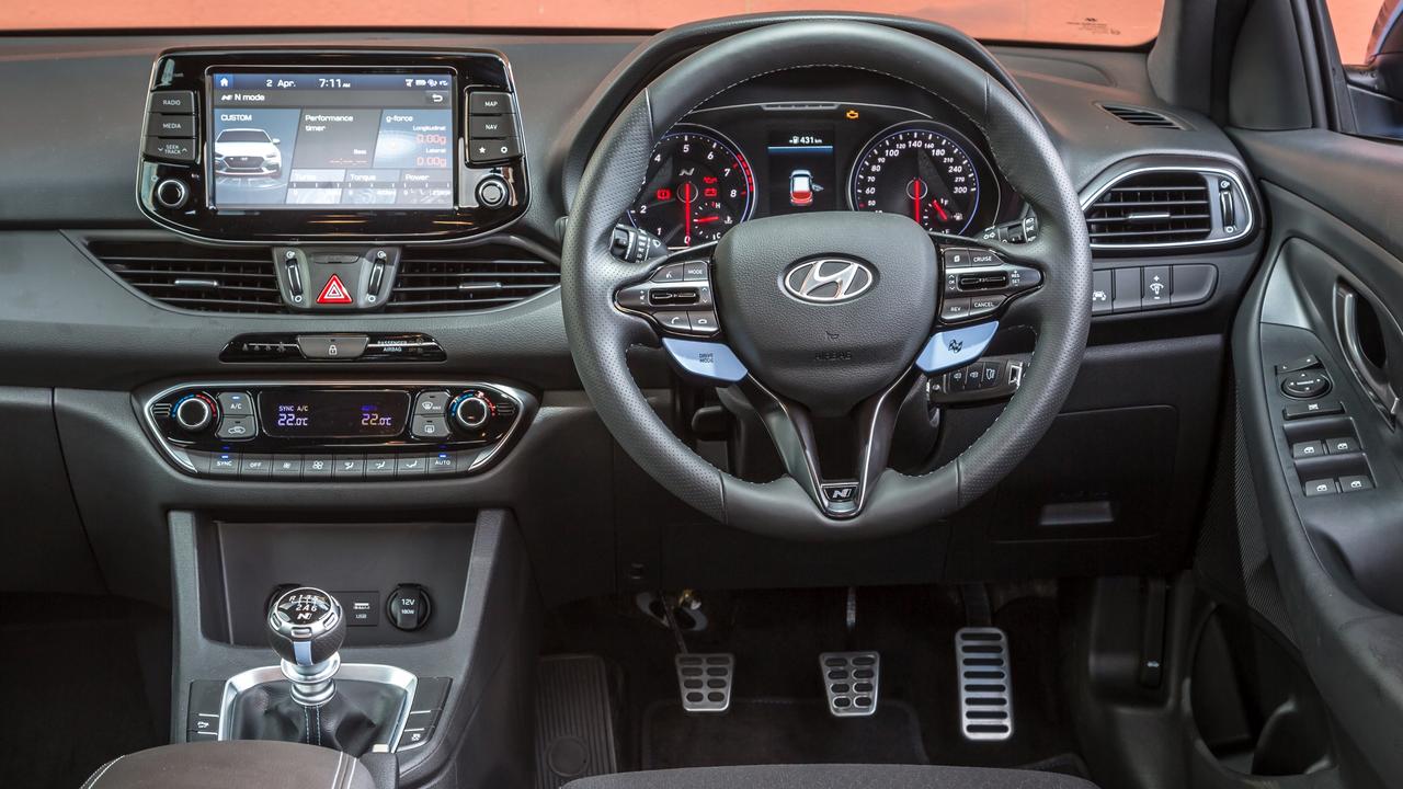 The Hyundai cabin is the most downmarket among this trio, but it also has the most gadgets to adjust the driving experience. Picture: Thomas Wielecki.