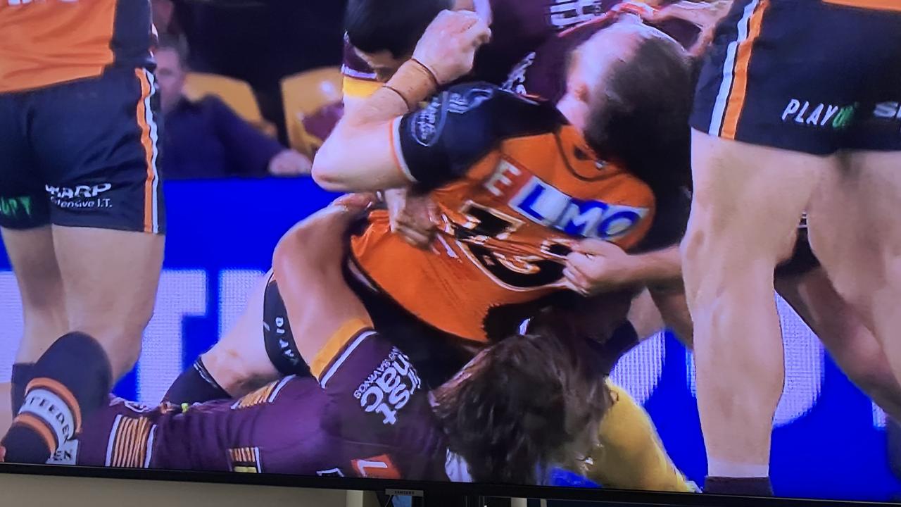 Wests Tigers’ Jackson Hastings is injured in a tackle that resulted in Brisbane Broncos’ Pat Carrigan going on report