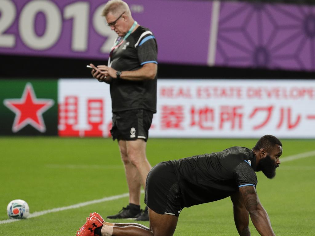 Fiji winger Semi Radradra stretches in front of coach John McKee at training on Friday. Picture: AP