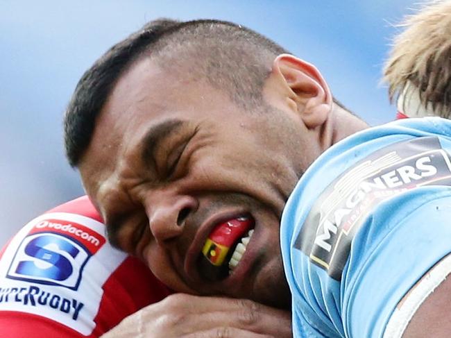 SYDNEY, AUSTRALIA - MAY 18: Kurtley Beale of the Waratahs is tackled during the round 14 Super Rugby match between the Waratahs and the Lions at Allianz Stadium on May 18, 2014 in Sydney, Australia. (Photo by Matt King/Getty Images)