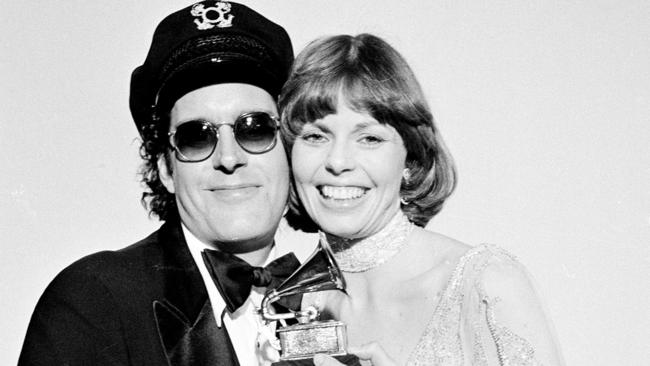 Daryl Dragon and his wife Toni Tennille, of the Captain &amp; Tennille, hold the Grammy award they won for record of the year for Love Will Keep Us Together.