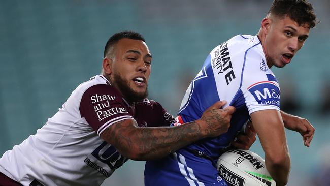 SYDNEY, AUSTRALIA - SEPTEMBER 11: Jake Averillo of the Bulldogs looks to pass the ball during the round 18 NRL match between the Canterbury Bulldogs and the Manly Sea Eagles at ANZ Stadium on September 11, 2020 in Sydney, Australia. (Photo by Cameron Spencer/Getty Images)