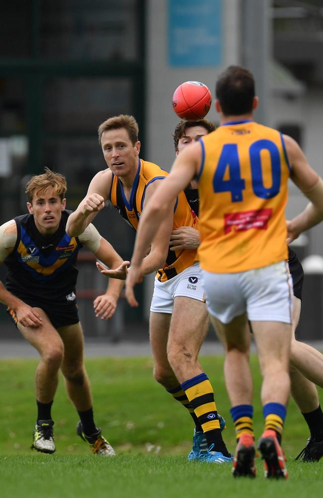 Chad Jones in a rare moment with a defender on his tail. Picture: VAFA media.