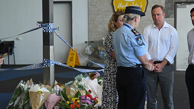 Premier Steven Miles visits the site to lay flowers, with Police Commissioner Katarina Carroll after the alleged murder of Vyleen White, 70, of Redbank Plains. Photo: Lyndon Mechielsen/Courier Mail