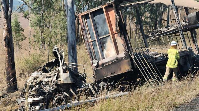 The charred wreckage of one truck involved in the southern crash at Miriam Vale on the Bruce Hwy. Picture: Rodney Stevens