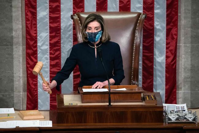 Speaker of the House Nancy Pelosi puts down the gravel as she presides the US House of Representatives vote on the impeachment of US President Donald Trump at the US Capitol, January 13, 2021, in Washington, DC. - The Democrat-controlled US House of Representatives on January 13 opened debate on a historic second impeachment of President Donald Trump over his supporters' attack of the Capitol that left five dead. (Photo by SAUL LOEB / AFP)