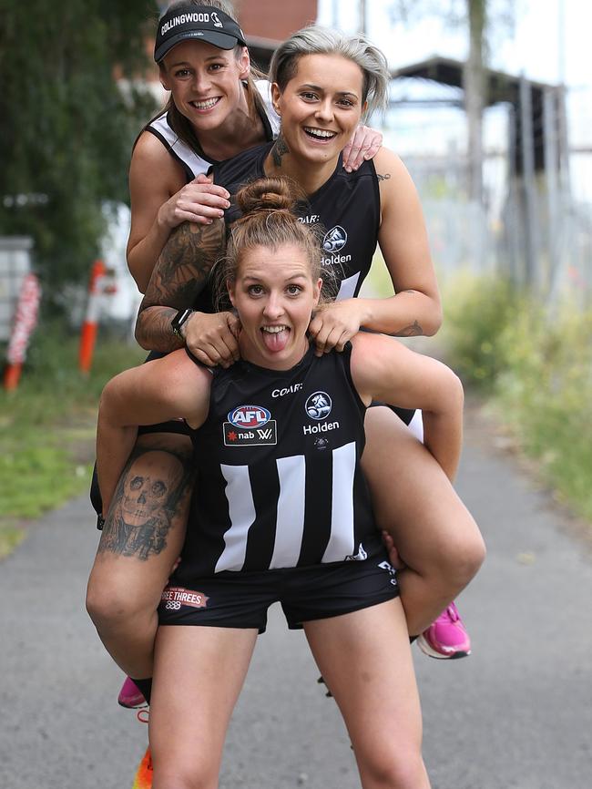 Emma King lifts teammates Moana Hope and Alicia Eva. Picture: Wayne Ludbey