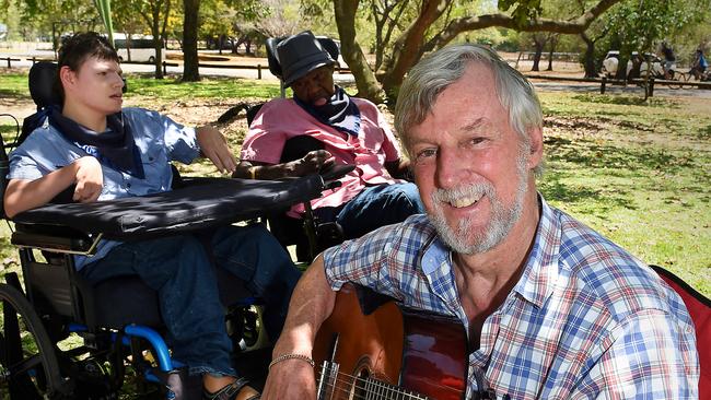 Chris Tudor plays to Michael Cole and Greg Wood at a Disability Awareness Festival Family Fun Day @ East Point. He has been appointmented to the Order of Australia — the highest recognition for outstanding achievement and service.