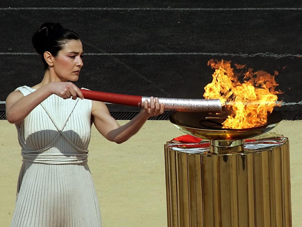 History of Olympic flame relays: in pictures | Herald Sun