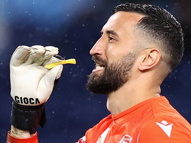 *APAC Sports Pictures of the Week - 2022, October 10* - SYDNEY, AUSTRALIA - OCTOBER 08: Paul Izzo of Victory holds a hot chip after they were thrown at him during the round one A-League Men's match between Sydney FC and Melbourne Victory at Allianz Stadium, on October 08, 2022, in Sydney, Australia. (Photo by Cameron Spencer/Getty Images)