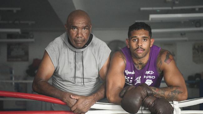 Melbourne Storm winger Josh Addo-Carr (right) with his granddad and former Australian boxing champion Wally Carr. Photo: NRL Photos.