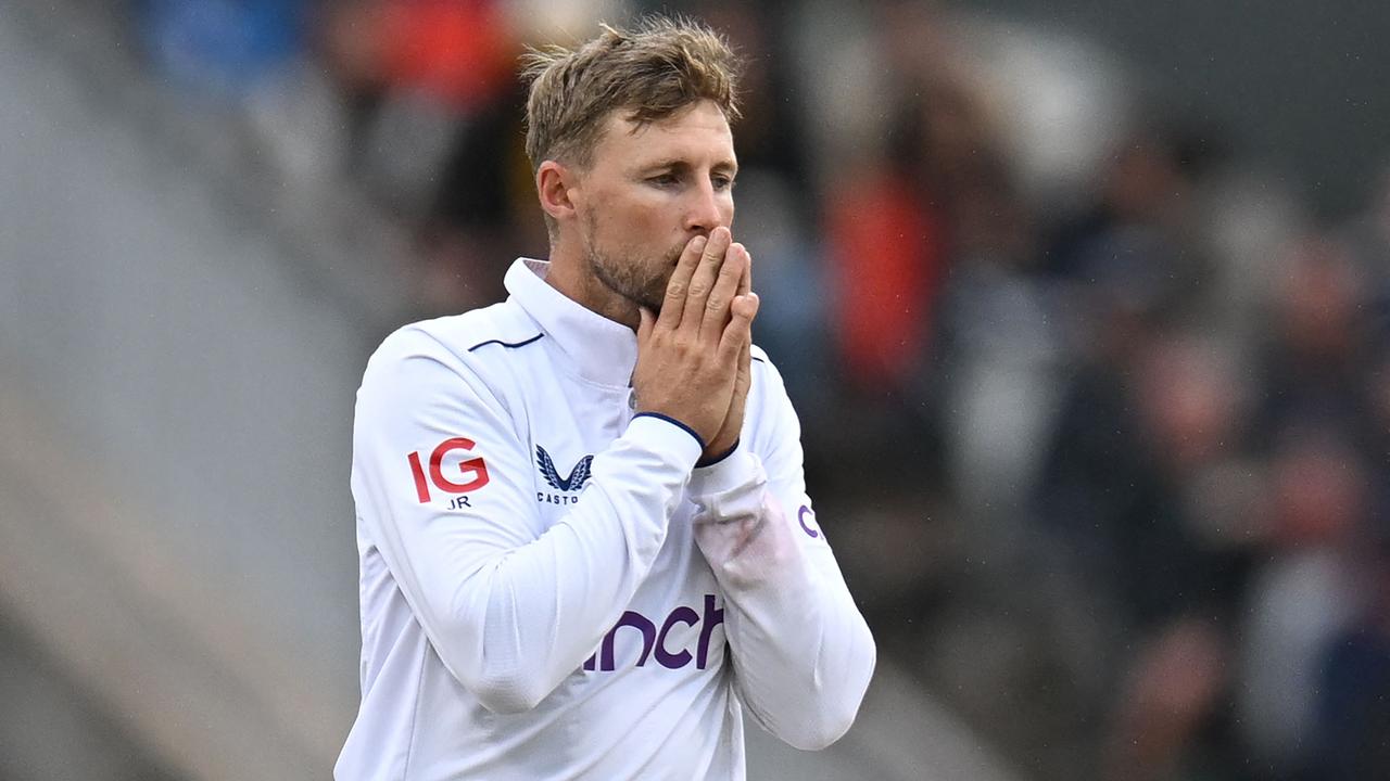 England were forced to call on Joe Root to bowl crucial overs late on day four as the gloom took over Old Trafford. Picture: AFP