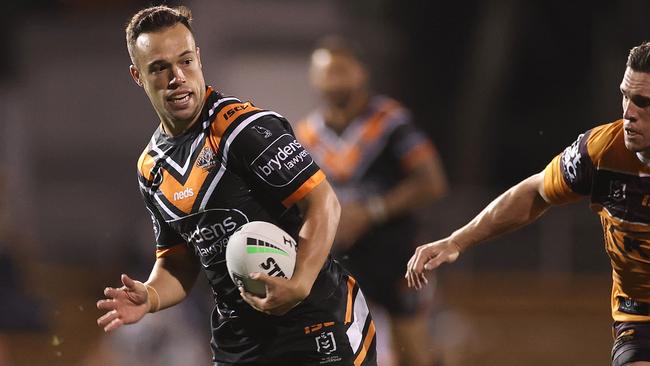 SYDNEY, AUSTRALIA - JULY 17: Luke Brooks of the Wests Tigers breaks through the defence during the round 10 NRL match between the Wests Tigers and the Brisbane Broncos at Leichhardt Oval on July 17, 2020 in Sydney, Australia. (Photo by Cameron Spencer/Getty Images)