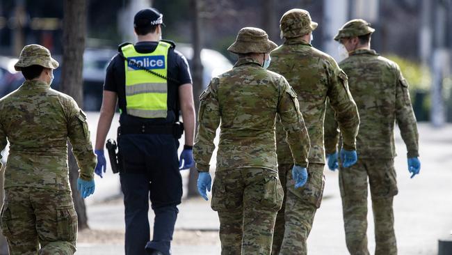 Victorian Police and Australian Defence Force members patrol Melbourne. Picture: NCA NewsWire / Sarah Matray