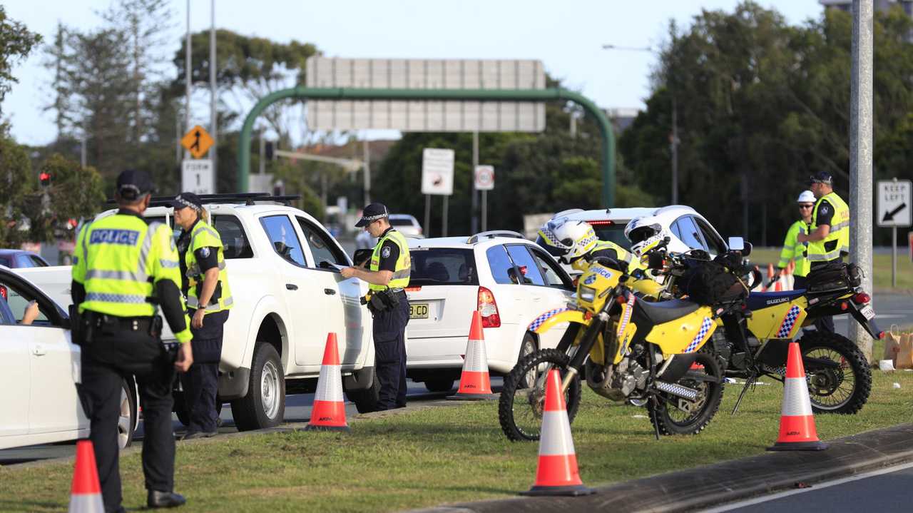 Queensland Police set up a road block due to the Corona Virus at the NSW / Queensland Border on the old Pacific Highway at Coolangatta. Photo: Scott Powick Newscorp