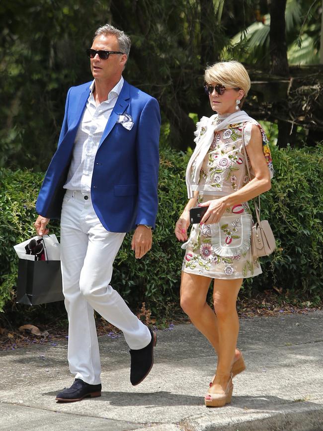 Foreign Minister Julie Bishop pictured with partner David Panton leaving a garden party celebrating the marriage. Picture: Richard Dobson