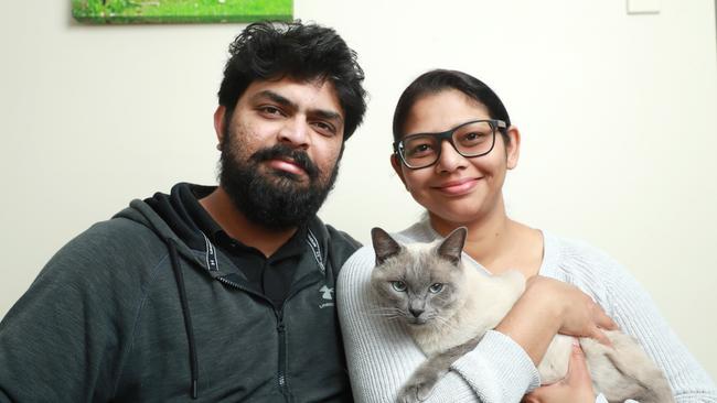 FIP patient Zeus with owners Imraaz Khan and Jotyshna Khan. Picture: John Feder