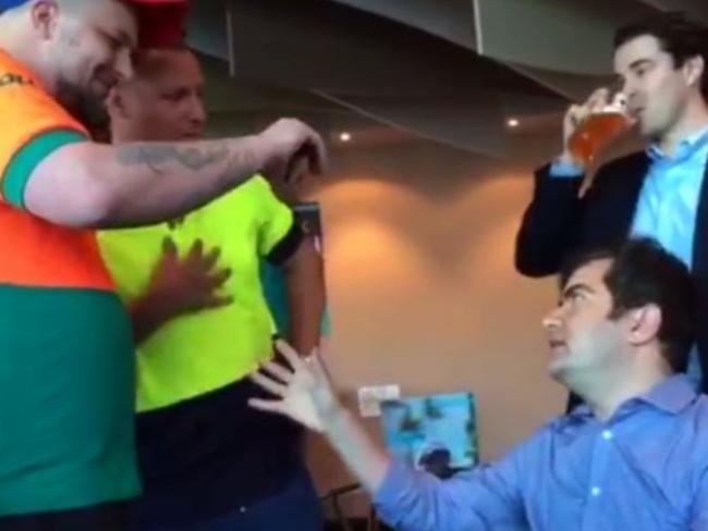 Far-right activist Neil Erikson wore his old Toll work shirt when he confronted Sam Dastyari.