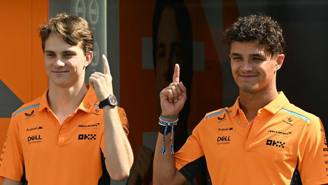 TOPSHOT - McLaren's Australian driver Oscar Piastri (L) and McLaren's British driver Lando Norris pose ahead of the Formula One Azerbaijan Grand Prix in Baku on September 12, 2024. (Photo by Natalia KOLESNIKOVA / AFP)