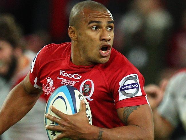 BRISBANE, AUSTRALIA - JULY 09: Will Genia of the Reds makes a break during the 2011 Super Rugby Grand Final match between the Reds and the Crusaders at Suncorp Stadium on July 9, 2011 in Brisbane, Australia. (Photo by Cameron Spencer/Getty Images)