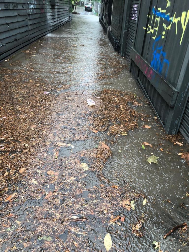 The downpour flooded local streets. 