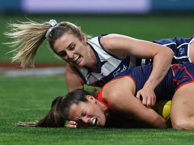 Geelong midfielder Amy McDonald lays a crunching tackle on Melbourne skipper Kate Hore. Picture: Daniel Pockett/Getty Images