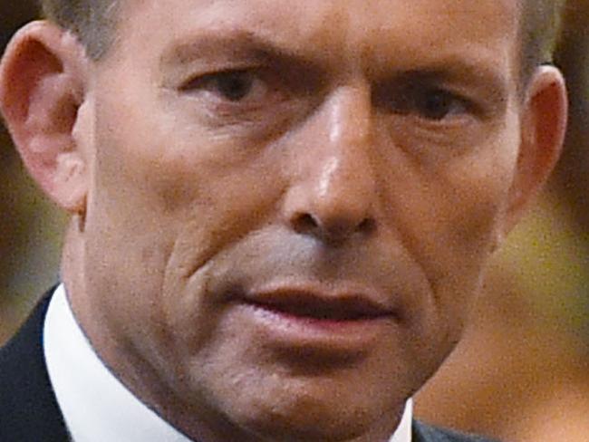 MELBOURNE, AUSTRALIA - MARCH 27: Prime Minister Tony Abbott is escorted to his seat whilst attending the funeral of former Australian Prime Minister Malcolm Fraser on March 27, 2015 in Melbourne, Australia. Australia's three term prime minister Fraser died at the age of 84 after a brief illness on March 20, 2015. (Theo Karanikos-Pool/Getty Images)