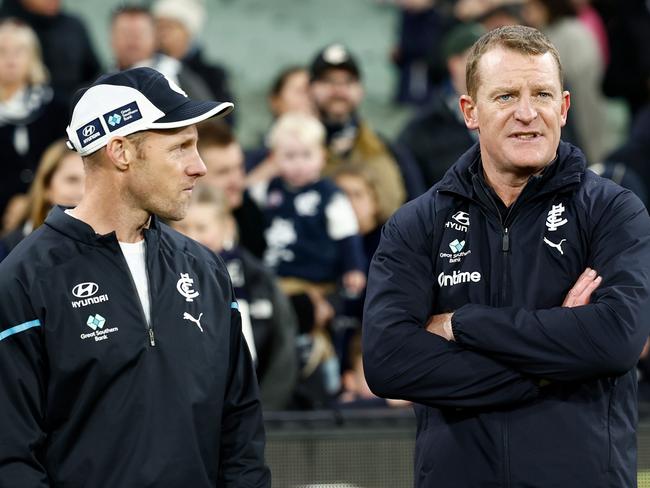 MELBOURNE, AUSTRALIA - JUNE 30: Andrew Russell and Michael Voss, Senior Coach of the Blues are seen during the 2024 AFL Round 16 match between the Richmond Tigers and the Carlton Blues at The Melbourne Cricket Ground on June 30, 2024 in Melbourne, Australia. (Photo by Michael Willson/AFL Photos via Getty Images)