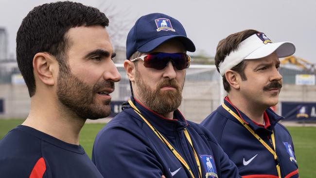 Jason Sudeikis as Ted Lasso (right) with Brendan Hunt (centre) and co-writer and co-star Brett Goldstein (left) who played Roy Kent.